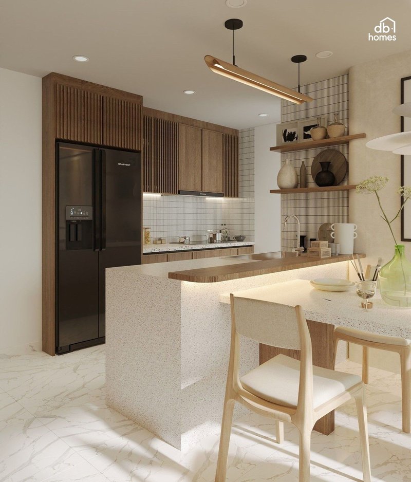 Thiết kế nội thất phòng bếp hiện đại theo phong cách Wabi Sabi sử dụng tông màu đất nhạt, kết hợp cùng ánh sáng ấm áp để mang lại không gian bình yên